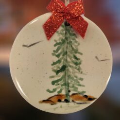 Evergreen-Tree-with-Red-Bow-on-Ceramic-Circle-Ornament_Christmas_Vacation_Shop_Bar_Harbor_Maine