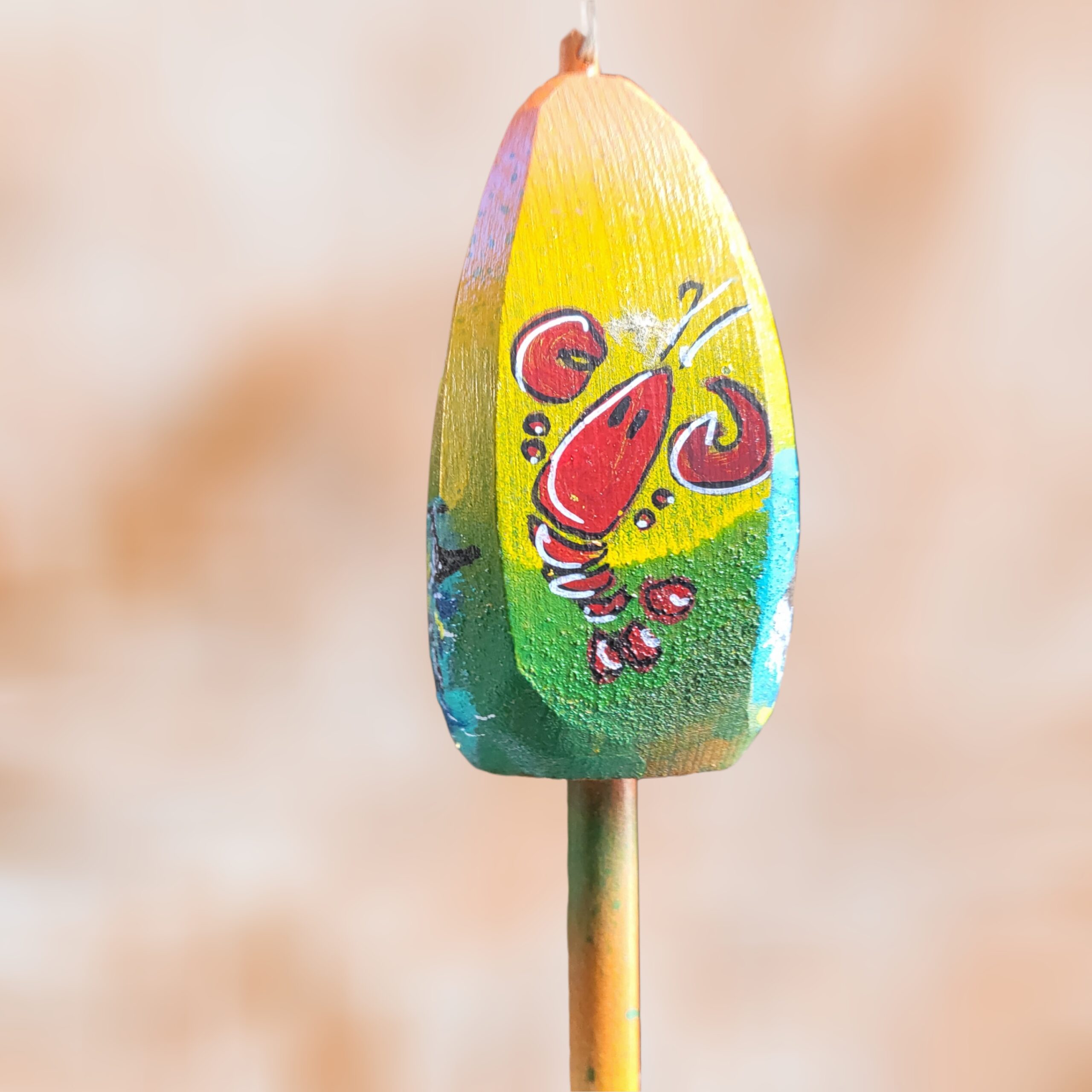 Red-Lobster-of-4-Sided-Buoy-Yellow-Green-Background_Christmas_Vacation_Shop_Bar_Harbor_Maine